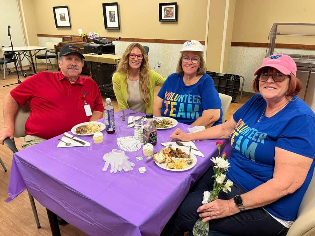 Group of seniors enjoying a meal at Four Pointes Center for Successful Aging.