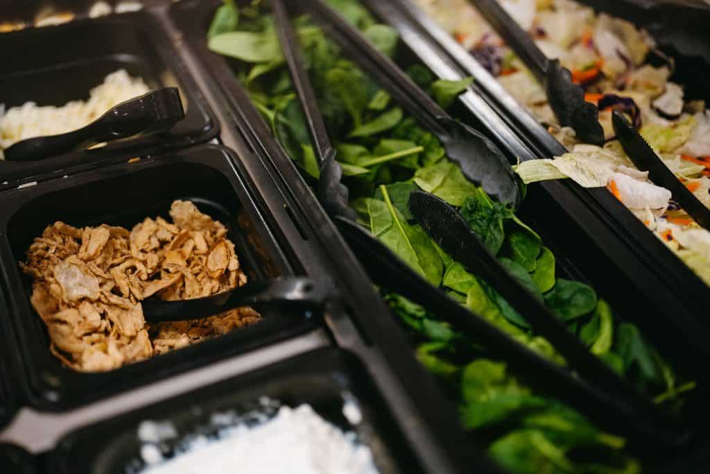 Fresh salad ingredients at All Season Innovations salad bar.
