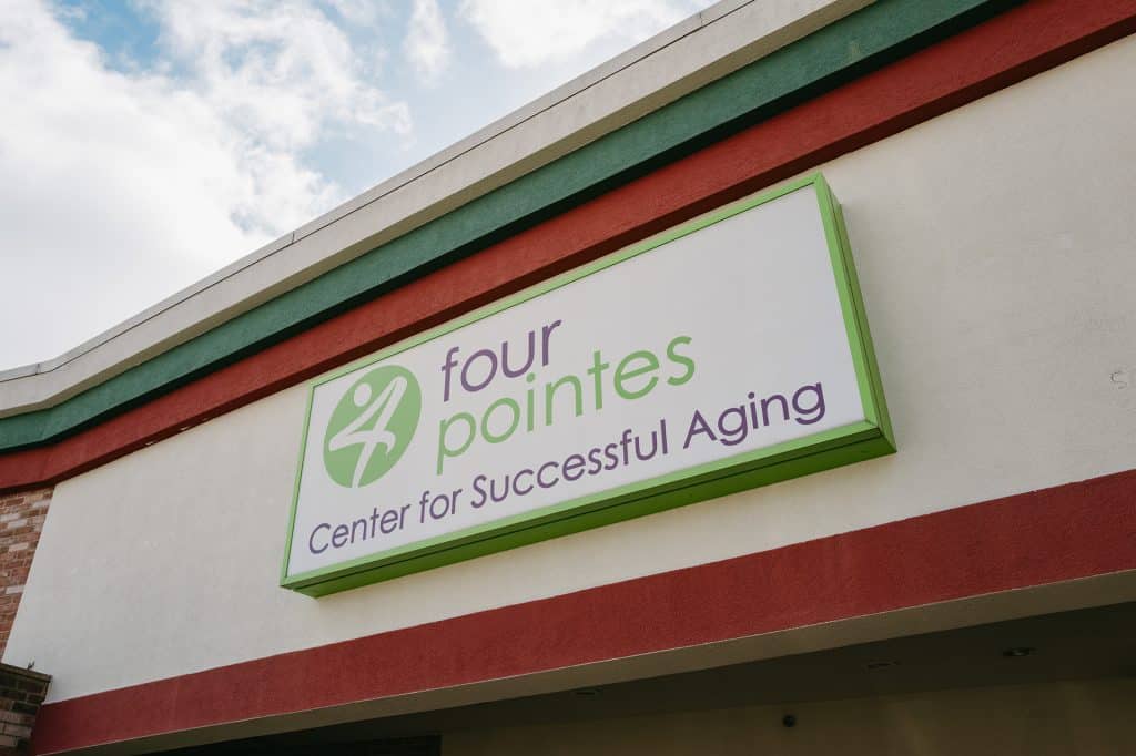 Exterior sign for Four Points Center for Successful Aging building.