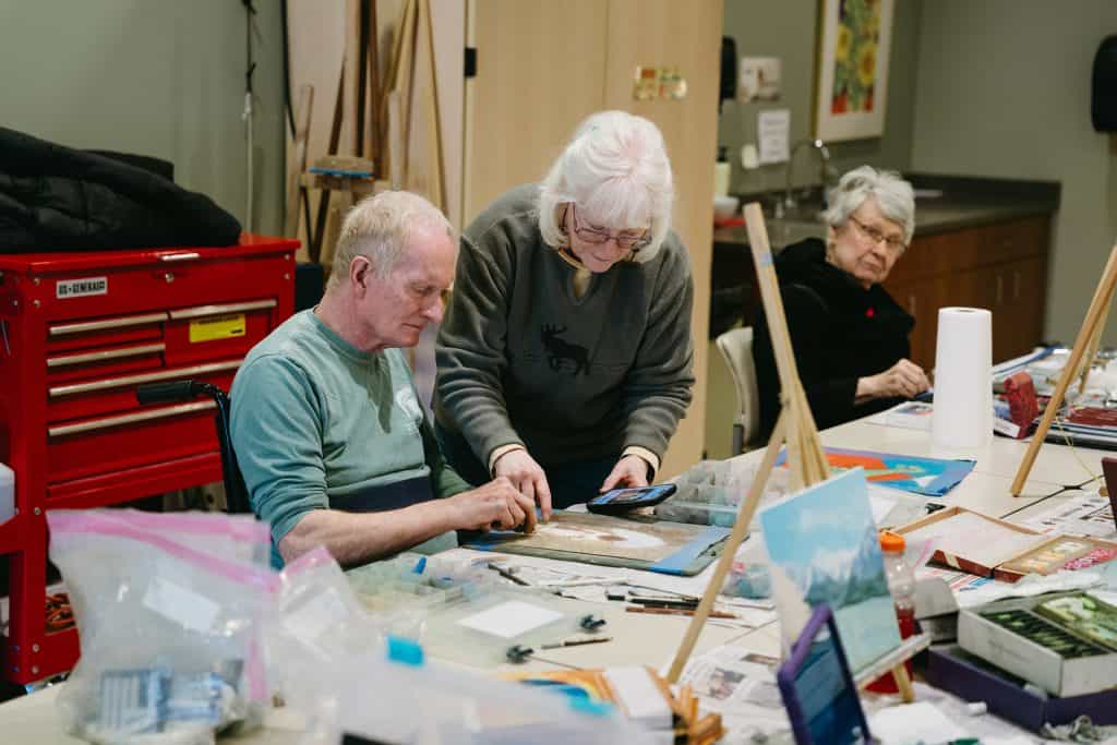 Older adults engaging in art activities at Four Pointes Center for Successful Aging.