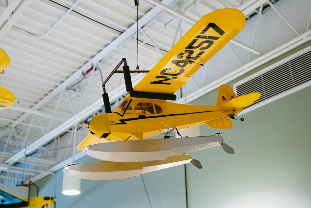 Yellow seaplane hanging from ceiling at Four Pointes Center.