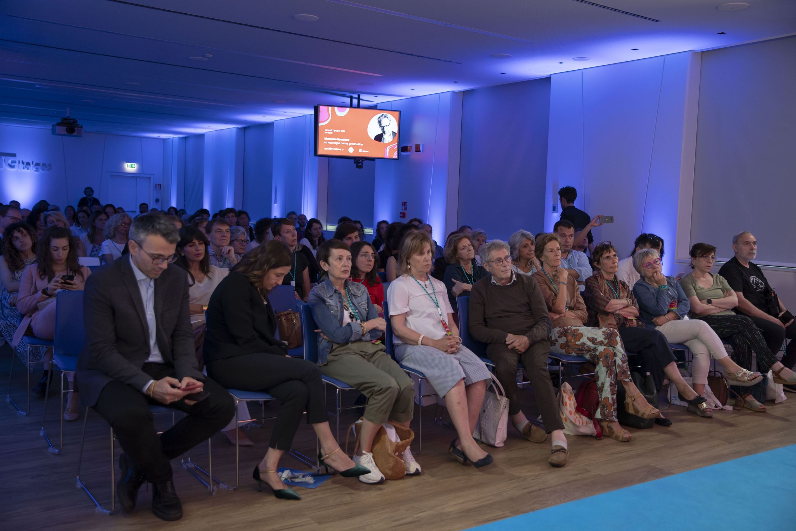 Audience at Heritage Lab event seated, facing a presentation with attentive expressions.