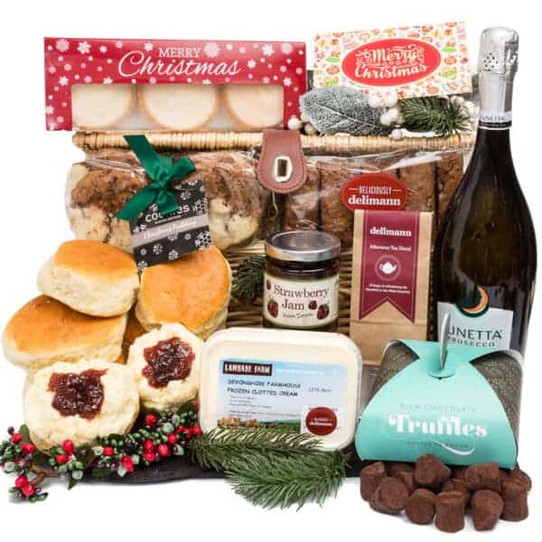 A festive hamper filled with delicious treats including Devon Sparkling Cream Tea Festive Feast, and festive chocolates.