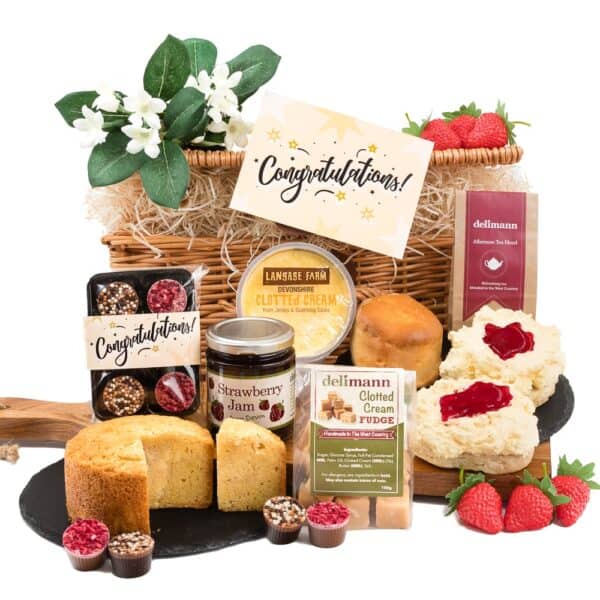 A cream tea with almond cake, fudge and congratulations vanilla and raspberry chocolates.