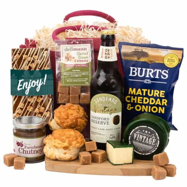 A Cheese & Nibbles Country Box gift basket with beer, cheese, and biscuits.