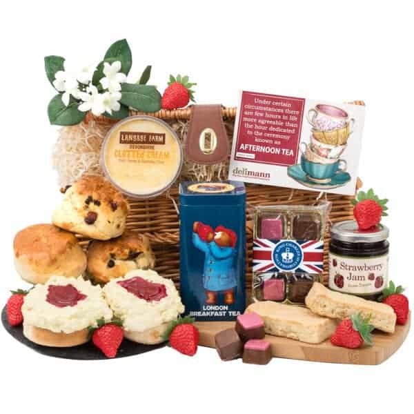 A British themed gift basket featuring Paddington's Devon Cream Tea and a variety of sweets.