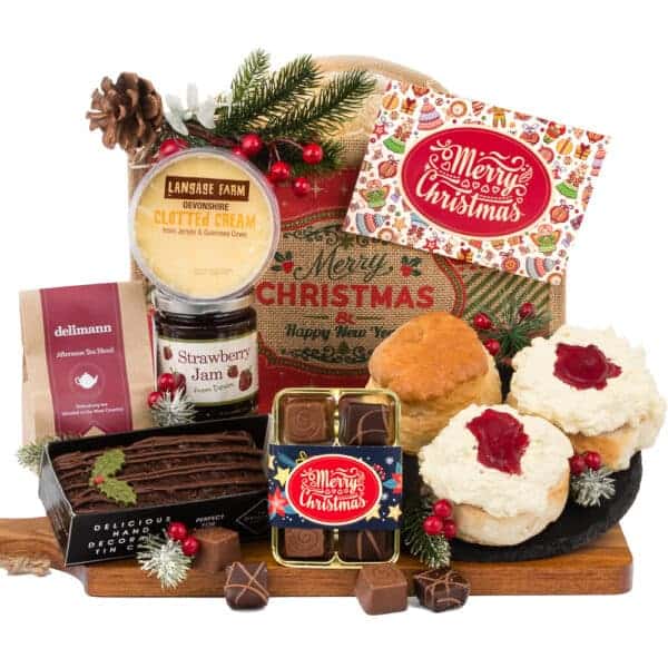 A Festive Chocolate Cream Tea hamper filled with a variety of treats, including merry Christmas chocolates and cream tea.