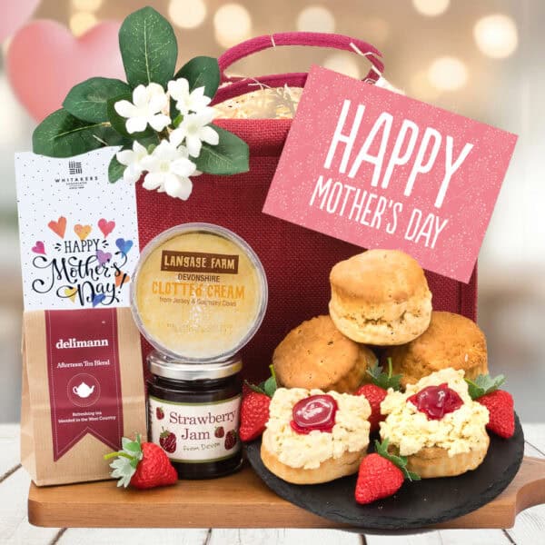 Celebrate Mother's Day with a Gluten Free Cream Tea For Mum. Featuring clotted cream, strawberry jam, scones, and a Mother's Day chocolate bar.