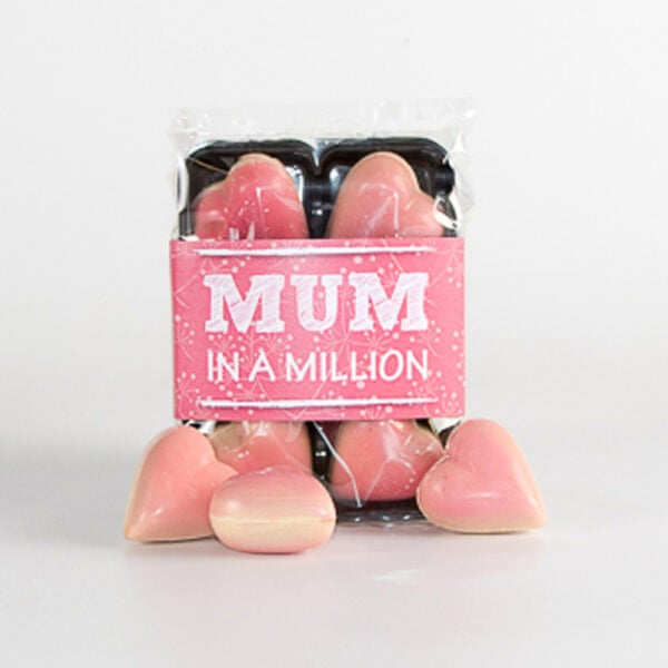 A pack labeled "Mum's Caramel Praline Hearts (6)" features pink heart-shaped praline chocolates, .with caramel centre.