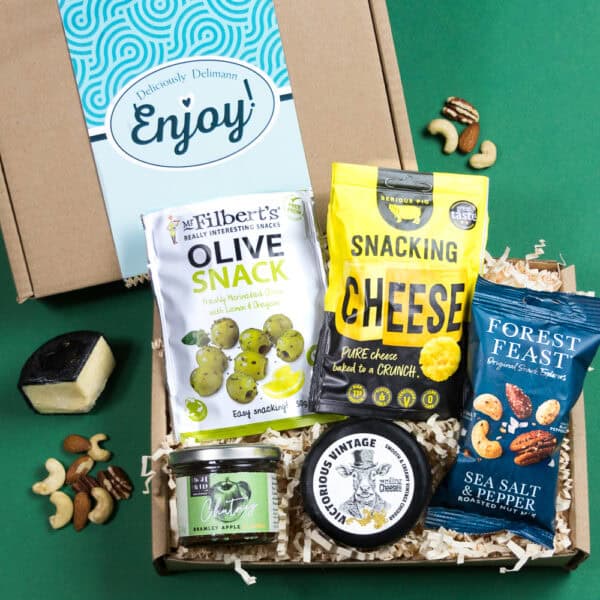 The Gluten Free Cheese & Nibbles Gift includes olive snack, snacking cheese, sea salt & pepper mixed nuts, cheddar cheese, chutney.
