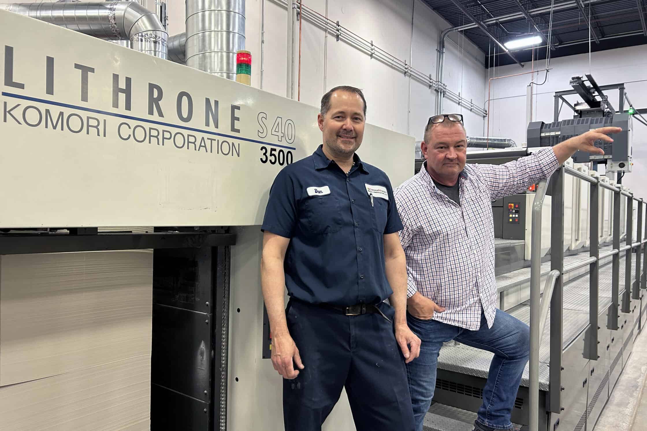 Left to right: Dan Keylard, Lead Pressman, and Joe Engwall, VP Operations, with the 8 colour Komori LS40 press.