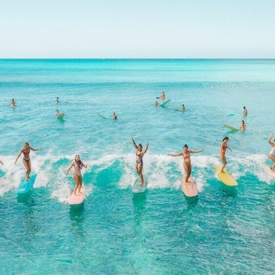 Copy of Copy of KBH_Surfer_Ladies_FINAL copy hero-min Take surf lessons at the Kaimana Beach Surf Shop.