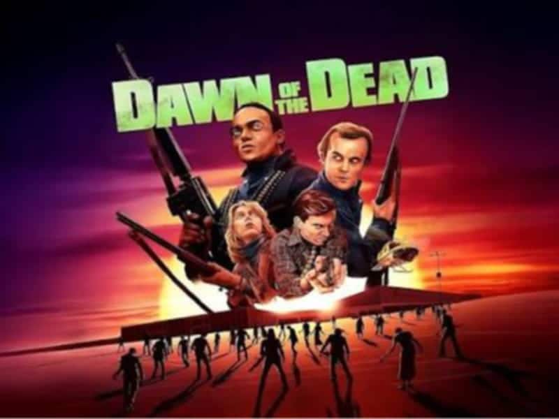 Poster for “Dawn of the Dead,” a classic in horror movies, shows armed characters above a mall as zombies approach below against a vivid sunset. Perfect for your 31 Days marathon!.