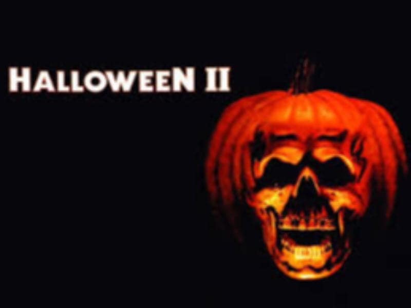 Halloween II“ text next to a glowing jack-o’-lantern with a skull face sets the mood for 31 days of horror movies on a black background.