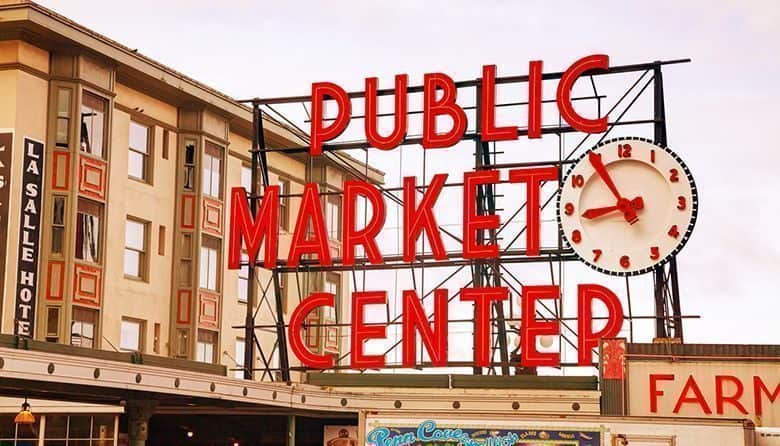 Seattle, USA - May 9, 2014: Famous Pike Place market sign in Seattle, WA. The Market opened in 1907, and is one of the oldest continuously operated public farmers' markets in the US.