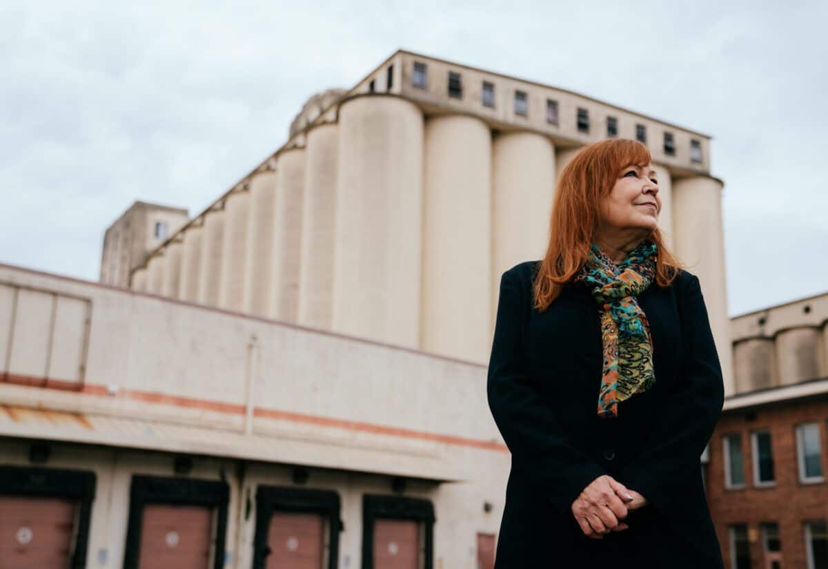 Kate Becker, Creative Economy and Recovery Director for King County Executive Dow Constantine, stands for a portrait outside Harbor Island Studios sound stage in Seattle, Friday, March 11, 2022. The 117,000 square foot warehouse is in the former Fisher Flour Mill location.  