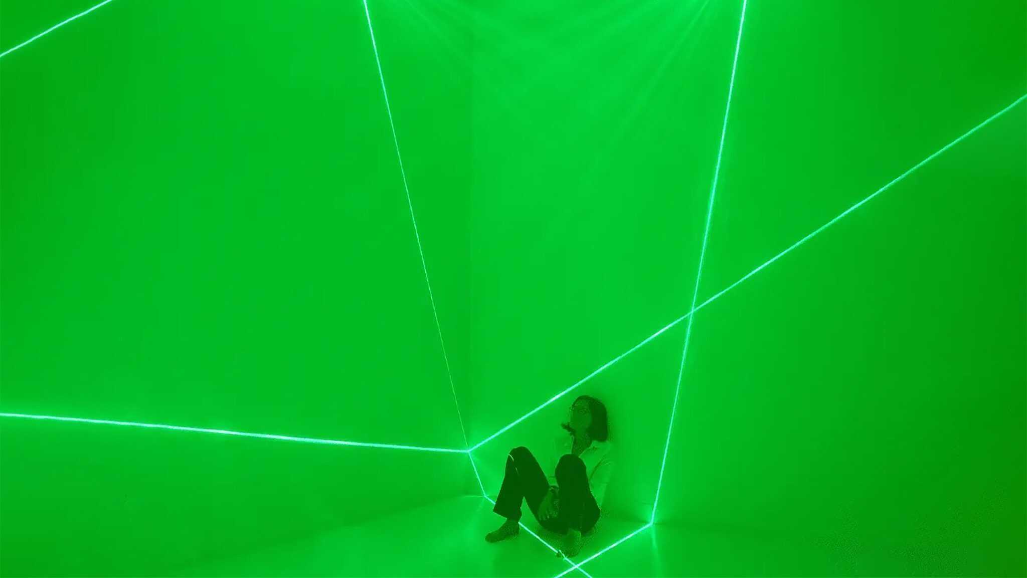 Iole Alessandrini Portrait A photo of the artist is framed within the luminous planes projected against the walls at Jack Straw Gallery in Seattle