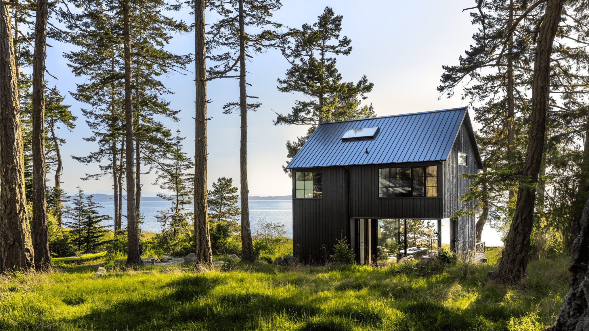 The house is black so as to better fit into its pastoral surroundings