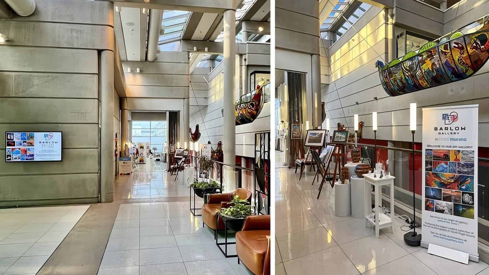 A modern art gallery interior with polished floors, concrete walls, art displays, sculptures, seating areas, and a large promotional banner for Barloh Gallery’s "Heart of Glass: A Weekend in Tacoma" exhibition.