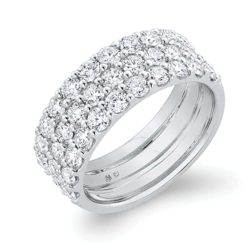 A wide white gold ring featuring three rows of round-cut diamonds set closely together around the band—an elegant choice for meaningful gifts.