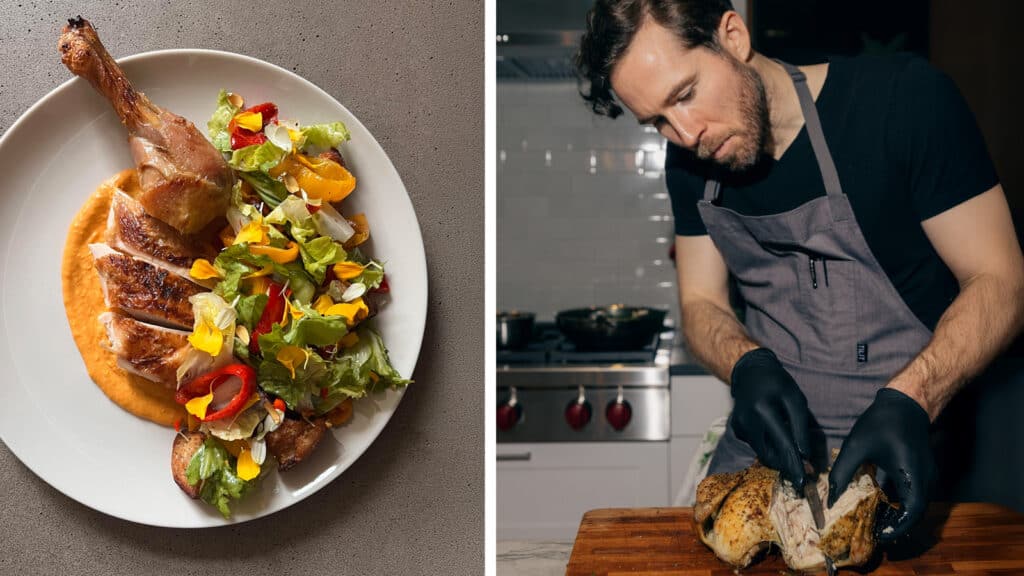 A chef wearing gloves carves a roasted chicken on a board; beside it, a plate displays sliced chicken with salad and sauce.