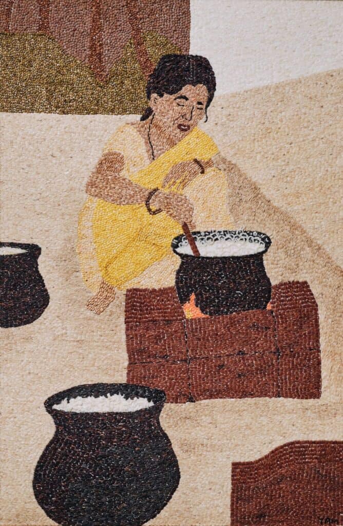 A woman in a yellow sari sits on the ground and stirs a pot over a brick stove, with two more pots nearby, in a textured artwork.