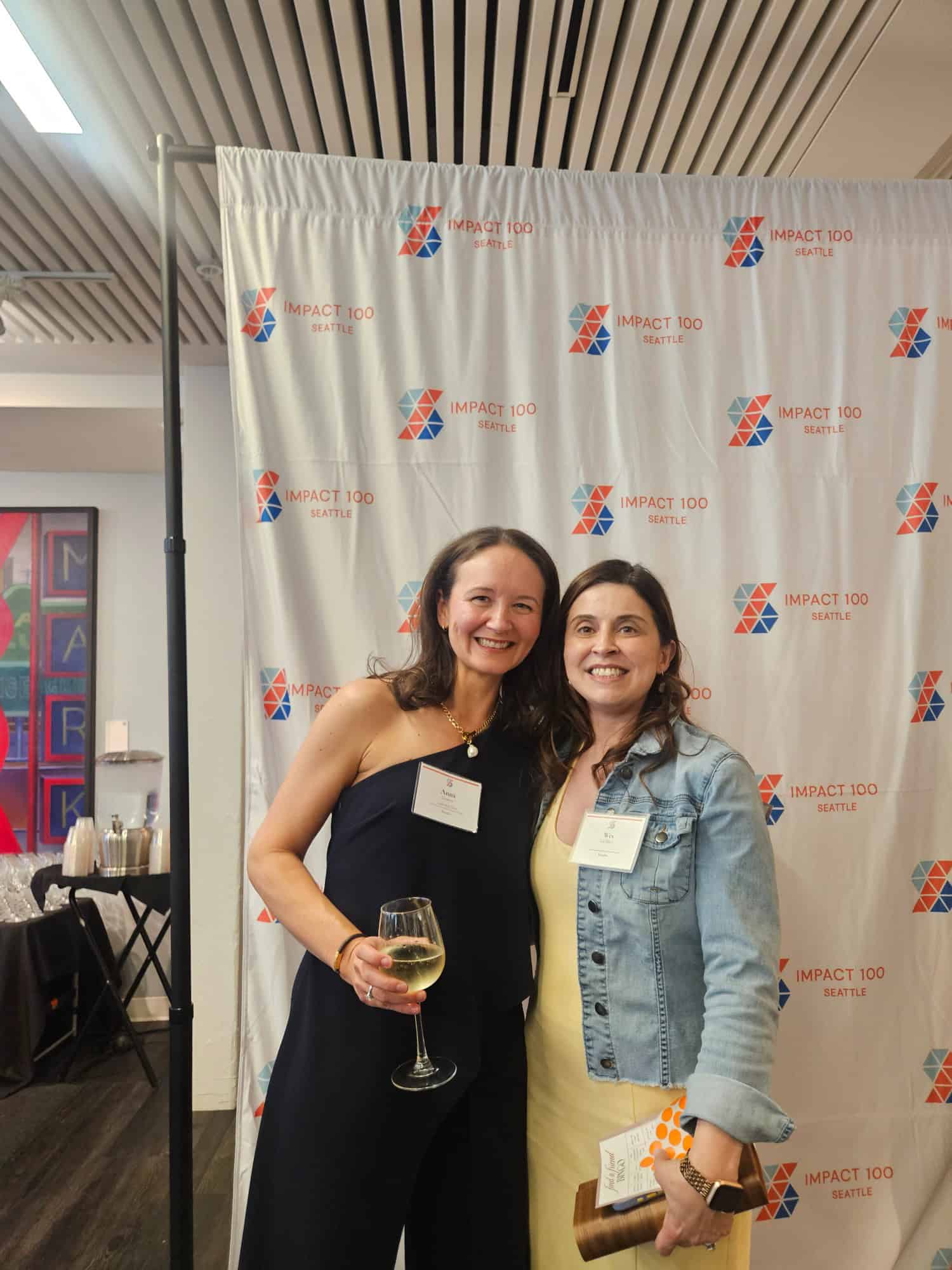 Impact 100, Outgoing President Anna Graves and member, Wes