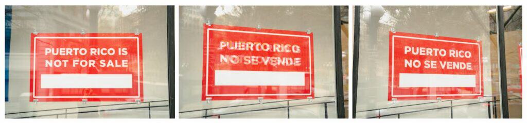 Three red signs in store windows read "Puerto Rico is not for sale" and "Puerto Rico no se vende" in English and Spanish. Blank white space appears below the text on each sign.