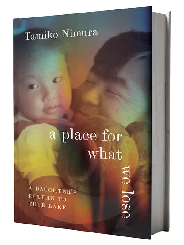 Book cover of "A Place for What We Lose" by Tamiko Nimura, a Washington author, featuring a faded photo of an adult holding a child, with rainbow light overlay and the subtitle, "A Daughter's Return to Tule Lake.