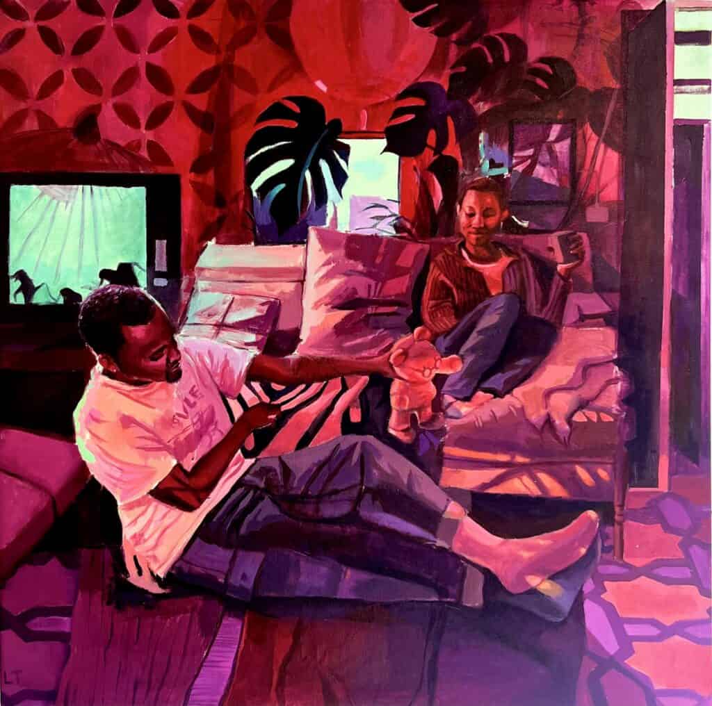 Two people sit in a living room with vibrant red lighting; one person lounges on a sofa holding a stuffed toy, while the other sits and looks at a mobile device.