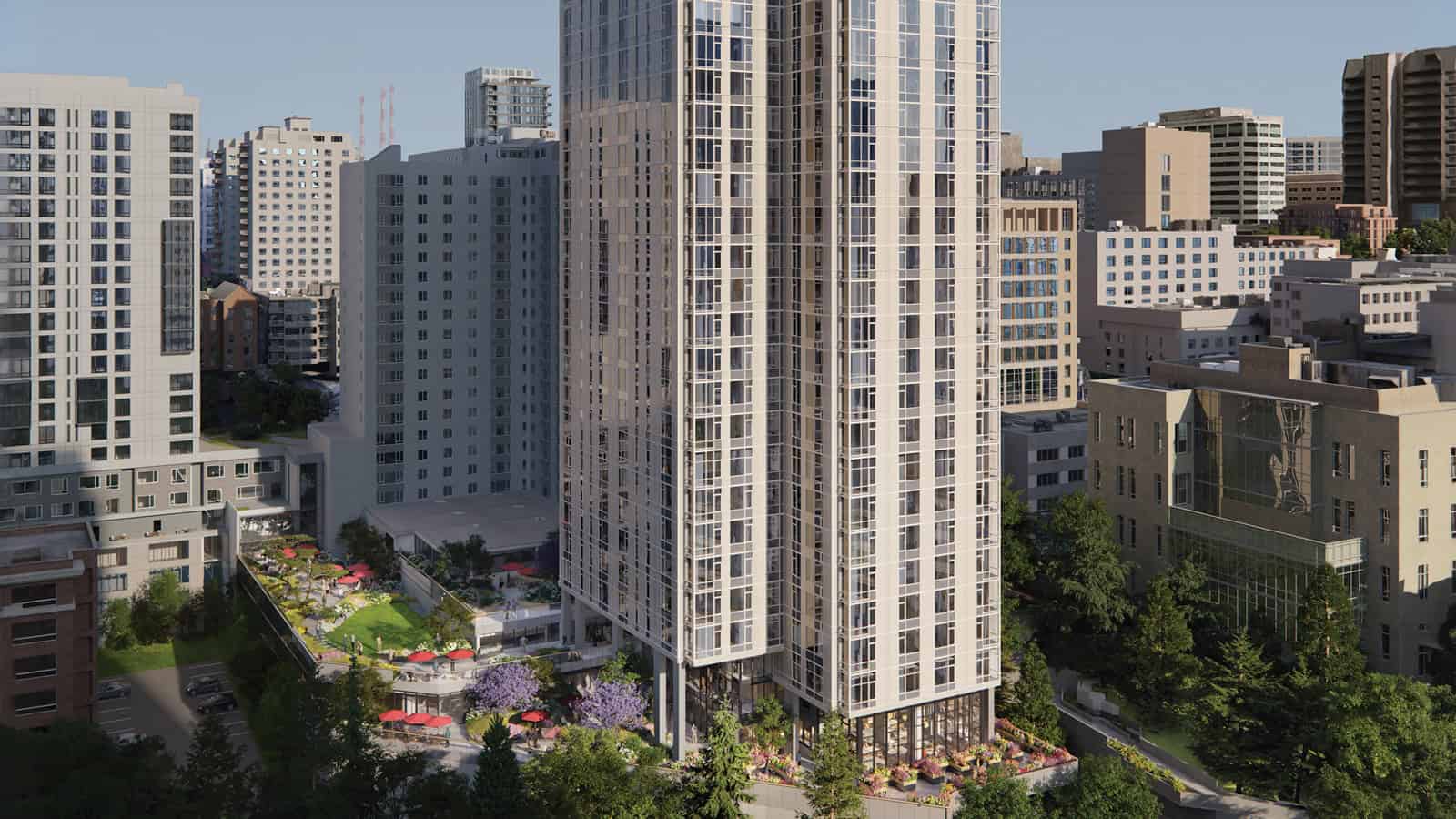 Tall modern apartment building surrounded by other mid- and high-rise buildings, with a landscaped courtyard and outdoor seating area at the base, set in an urban environment—an ideal example of Senior living high-rise Seattle, offering a vibrant lifestyle for residents in the heart of the city.
