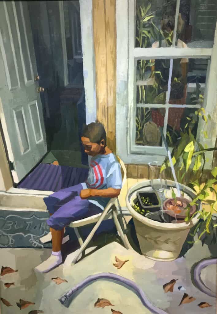 A boy sits on a folding chair by an open door, reading a book. Plants and gardening items are nearby, and fallen leaves and a hose are on the ground.