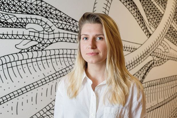 Artist Creates Mural Using Signature Dot-and-Lozenge Technique
