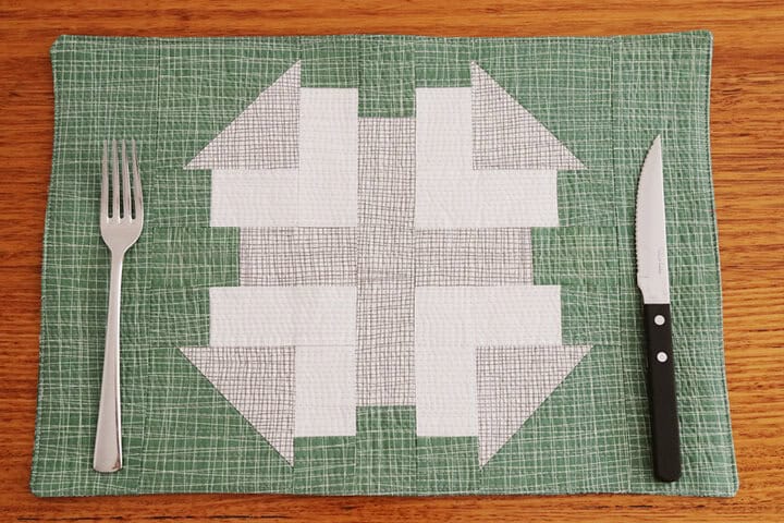 "Christmas Placemats from the Alex Quilt Block” is a Free Christmas Quilted Placemat Pattern designed by Kirsty from Bonjour Quilts!