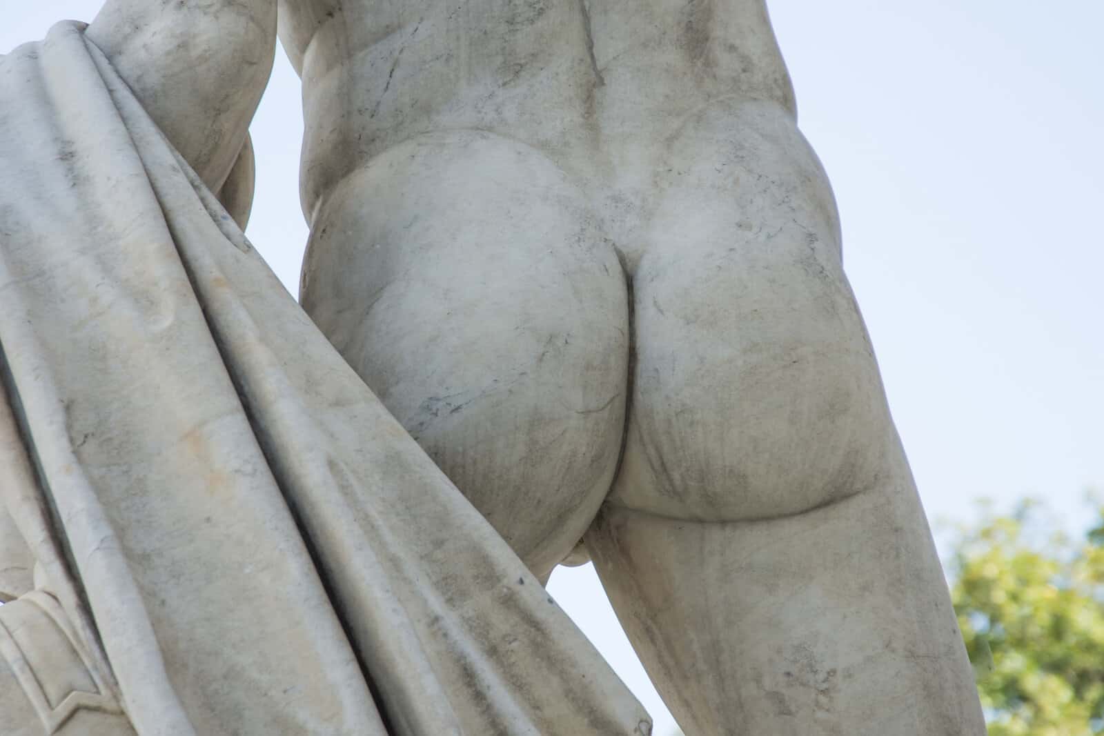 male-buttocks-sculpture-stone-monument-close