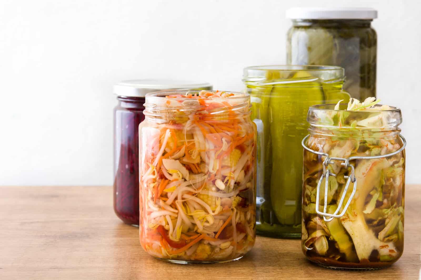 fermented-preserved-vegetables-in-jar-on-wooden-table