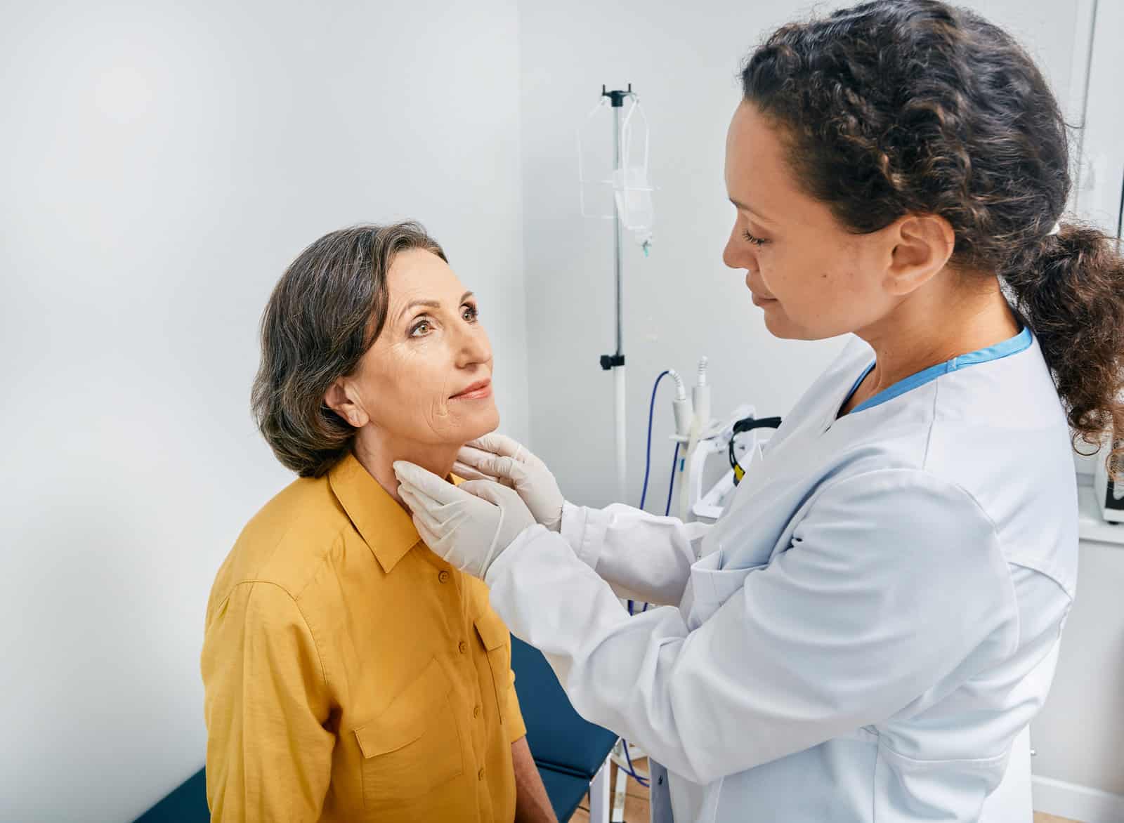 doctor-palpates-of-fat-mature-womans-neck-for-diagnostics-of-thyroid-diseases-and-hypothyroidism-at-medical-clinic-thyroid-treatment