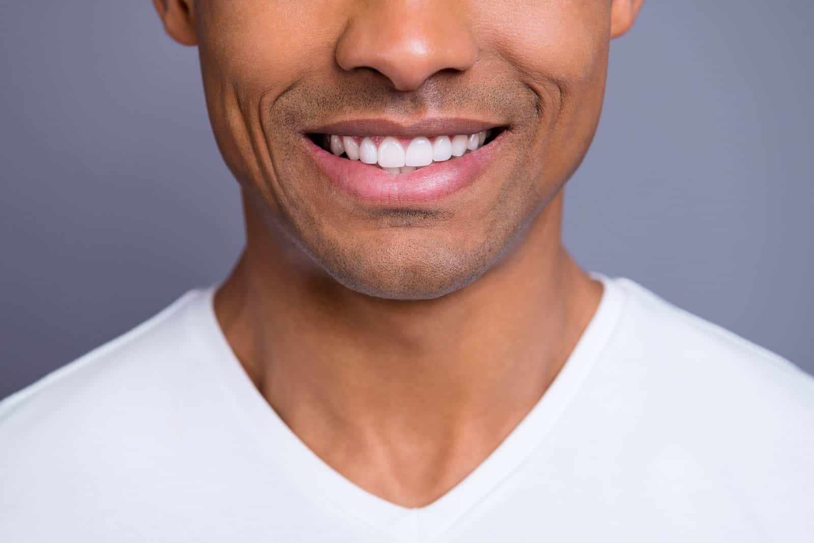 close-up-cropped-portrait-of-nice-handsome-attractive-cheerful-cheery-well-groomed-guy-wearing-white-shirt-beaming-shine-teeth-isolated-over-gray-violet-purple-pastel-background