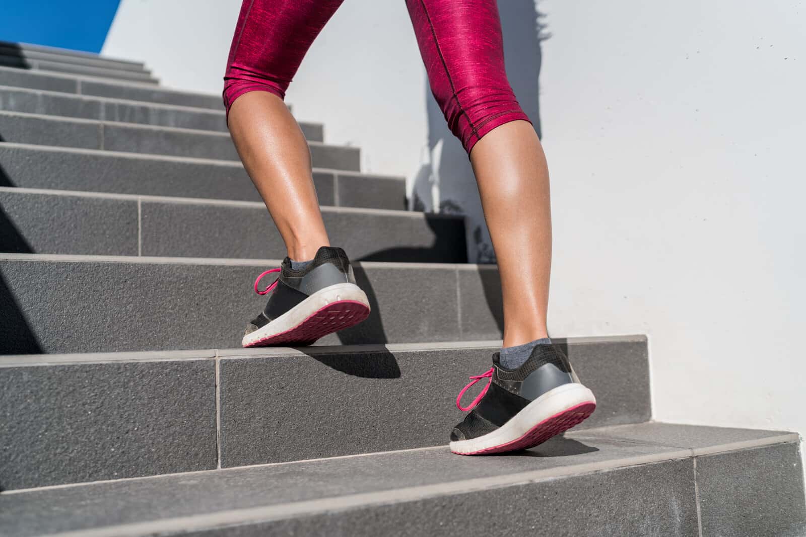 stairs-climbing-running-woman-doing-run-up-steps-on-staircase-female-runner-athlete-going-up-stairs-in-urban-city-doing-cardio-sport-workout-run-outside-during-summer-activewear-leggings-and-shoes