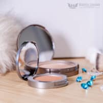 Colorescience Pressed Mineral Illuminator open compact in foreground with larger compact in background - mineral blush makeup available in Canada