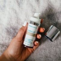 Hand holding Even Up Pigment Perfector by Colorescience - available in Canada