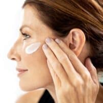 Woman applying Pep Up Collagen Renewal treatment cream by Colorescience on face - available in Canada