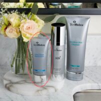 SkinMedica Ultra Sheer Moisturizer on bathroom sink with other SkinMedica products - shown for size comparison