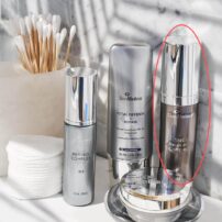 SkinMedica TNS Recovery Complex on bathroom sink with other products - shown for size comparison