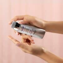 SkinMedica Total Defense + Repair Sunscreen for face being pumped onto finger for application