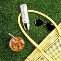 SkinMedica Total Defense + Repair sunscreen on grass styled image - available in Canada