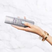 Hand holding SkinMedica Total Defense + Repair sunscreen showing size - available in Canada