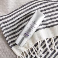 SkinMedica Total Defense + Repair face sunscreen on beach blanket - available in Canada