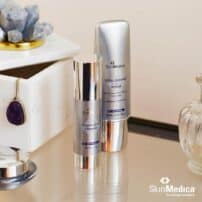 SkinMedica Vitamin C+E Complex on desk with Total Defense + Repair sunscreen - available in Canada