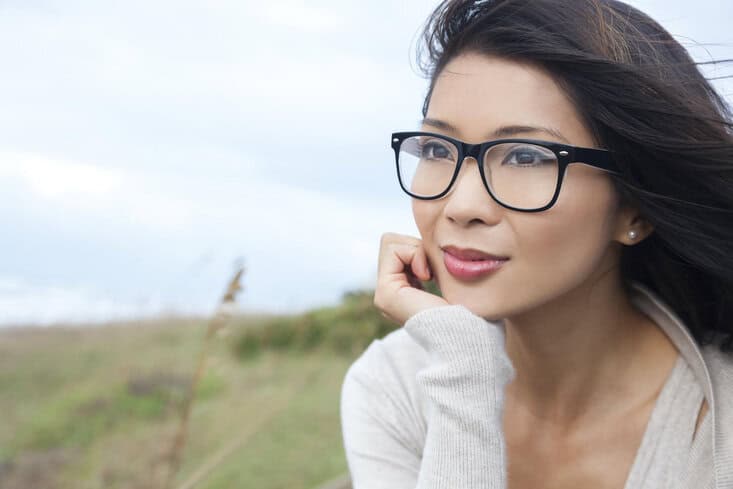 Asian woman with clear good skin and no wrinkles in 30s or 40s